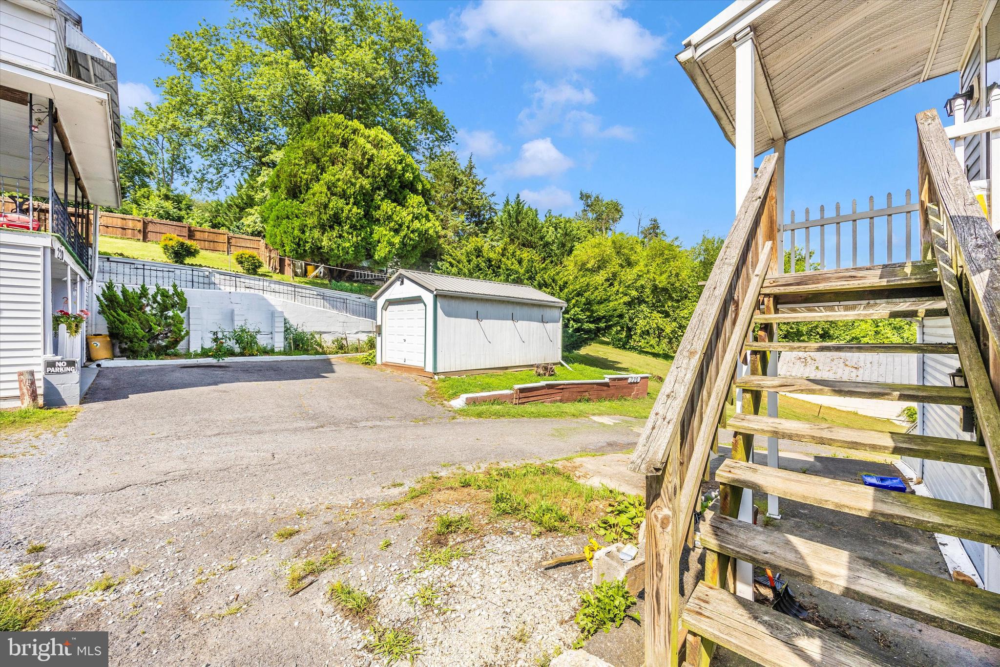 214 Jackson Street Hancock, MD 21750 - Photo 34 of 40 a front view of a house with a yard