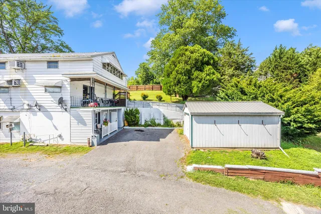 a house that has a tree in front of the house