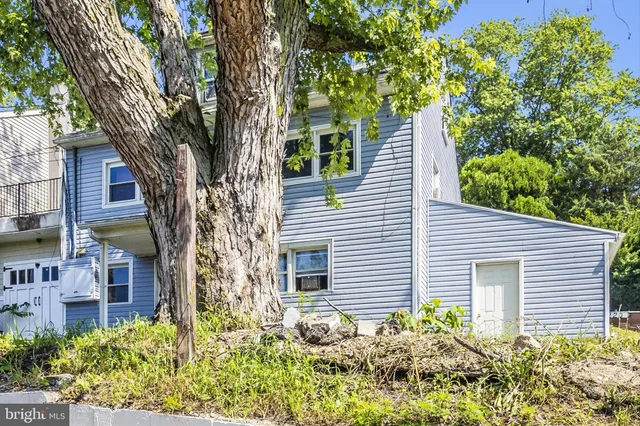 a view of a house with a window and sitting area