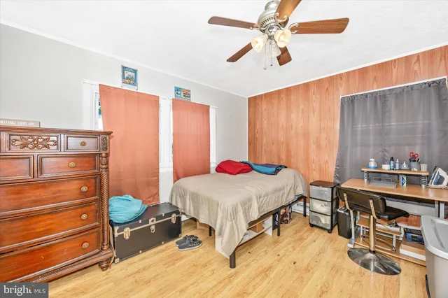 a bedroom with a bed and a table in it