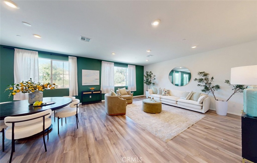 24320 Insignia Drive Menifee, CA 92584 - Photo 11 of 65 a living room with furniture a window and a table