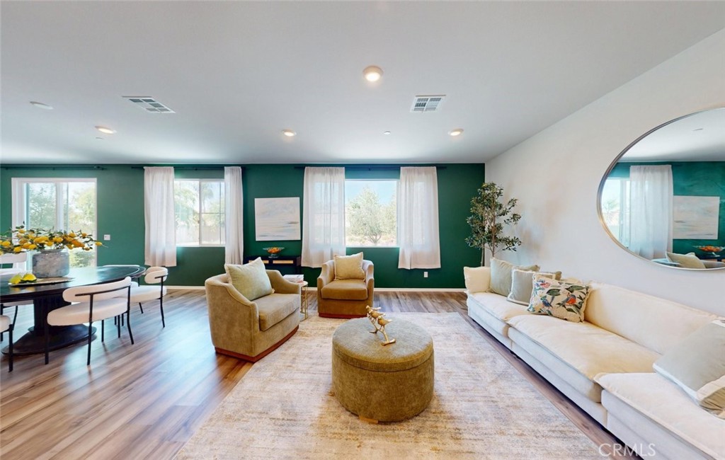 24320 Insignia Drive Menifee, CA 92584 - Photo 13 of 65 a living room with furniture and a wooden floor