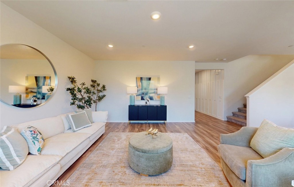 24320 Insignia Drive Menifee, CA 92584 - Photo 15 of 65 a living room with furniture and a chandelier