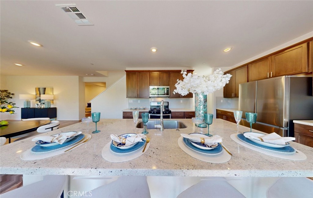 24320 Insignia Drive Menifee, CA 92584 - Photo 24 of 65 a kitchen with lots of counter top space
