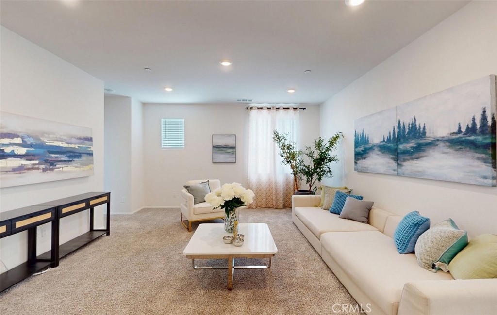 24320 Insignia Drive Menifee, CA 92584 - Photo 31 of 65 a living room with furniture and flowers