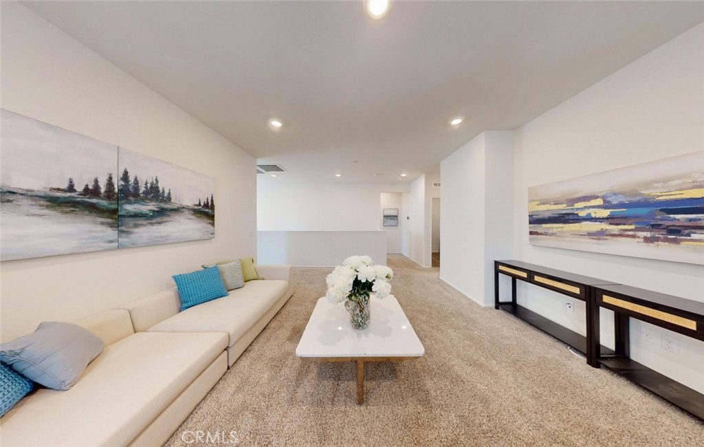 24320 Insignia Drive Menifee, CA 92584 - Photo 33 of 65 a living room with furniture and kitchen view