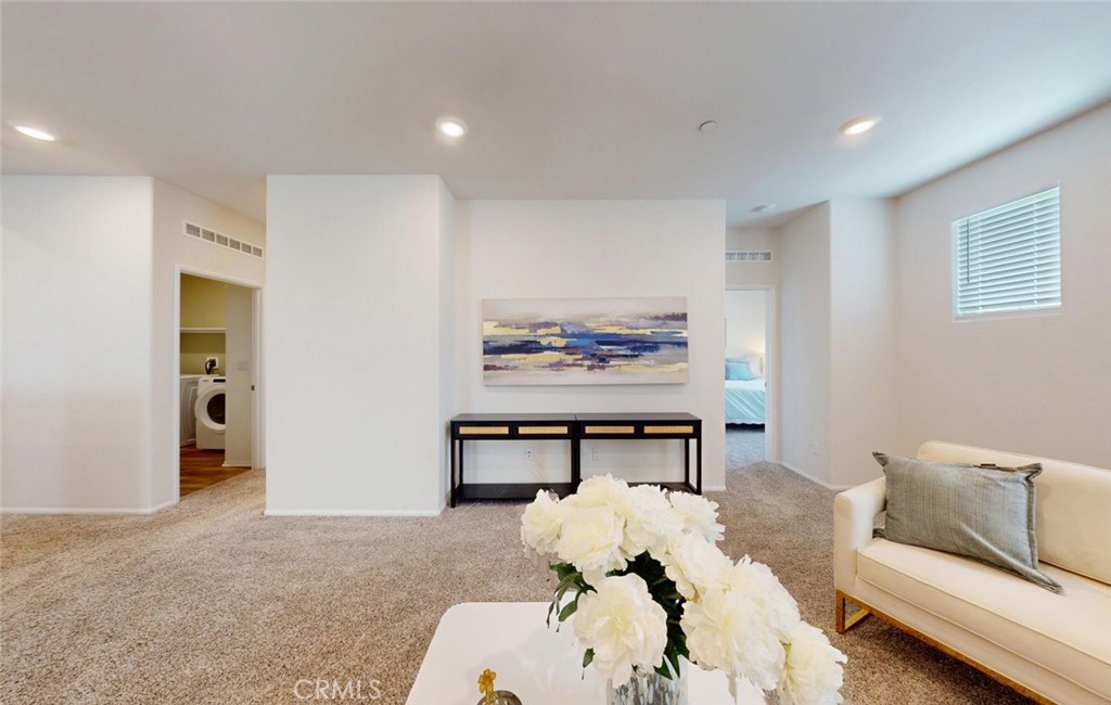24320 Insignia Drive Menifee, CA 92584 - Photo 34 of 65 a living room with furniture and a painting on the wall