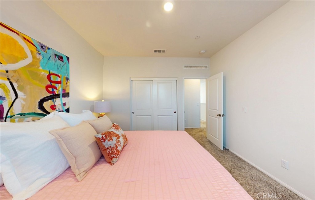 24320 Insignia Drive Menifee, CA 92584 - Photo 39 of 65 a bedroom with a bed and a window