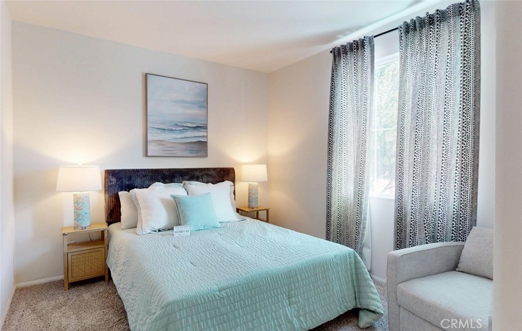 24320 Insignia Drive Menifee, CA 92584 - Photo 4 of 65 a bedroom with a bed and a couch