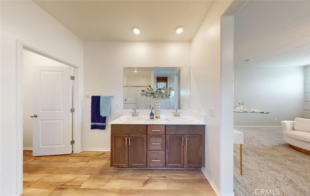 24320 Insignia Drive Menifee, CA 92584 - Photo 47 of 65 a bathroom with a sink and a mirror
