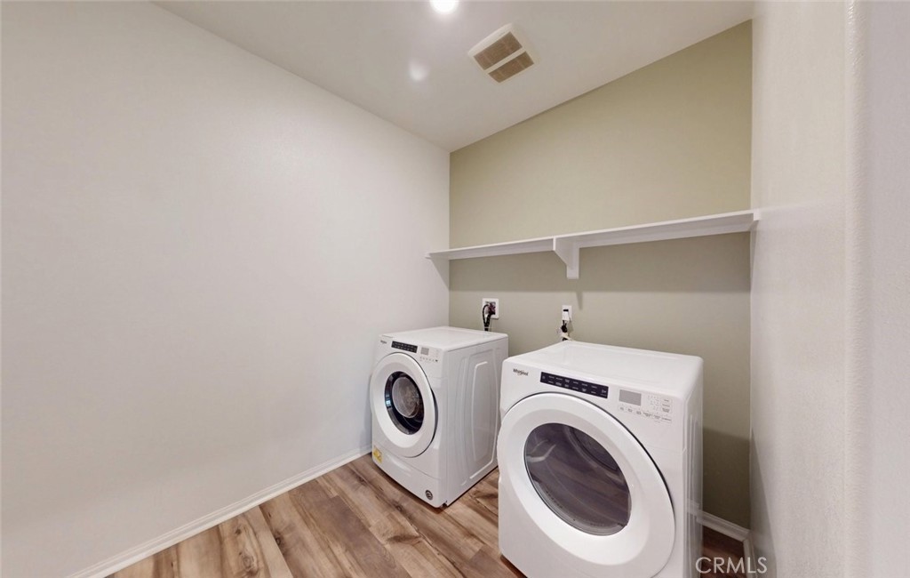 24320 Insignia Drive Menifee, CA 92584 - Photo 50 of 65 a utility room with dryer and washer
