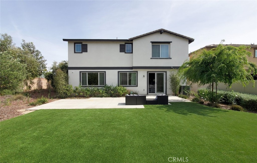 24320 Insignia Drive Menifee, CA 92584 - Photo 52 of 65 front view of a house with a yard