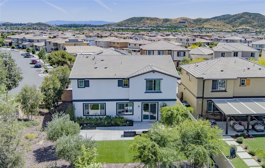 24320 Insignia Drive Menifee, CA 92584 - Photo 56 of 65 an aerial view of multiple houses with a mountain