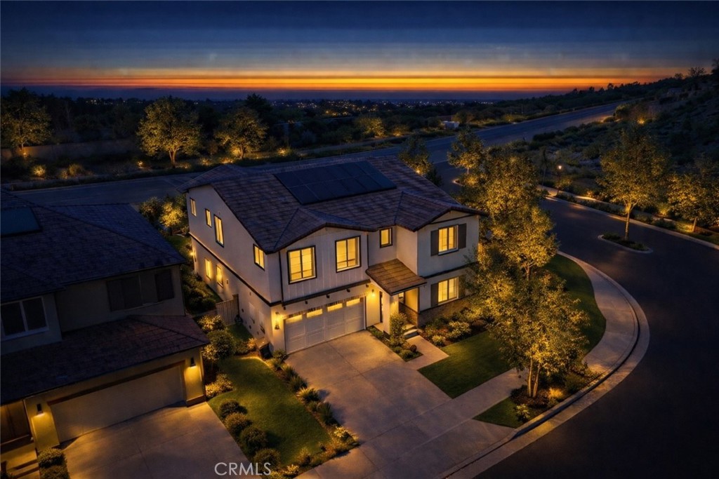 24320 Insignia Drive Menifee, CA 92584 - Photo 60 of 65 Twilight aerial with warm lighting