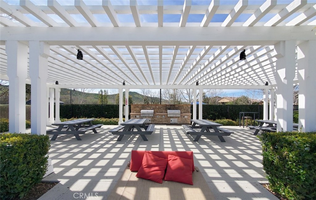 24320 Insignia Drive Menifee, CA 92584 - Photo 62 of 65 a outdoor living space with patio furniture and a flat screen tv