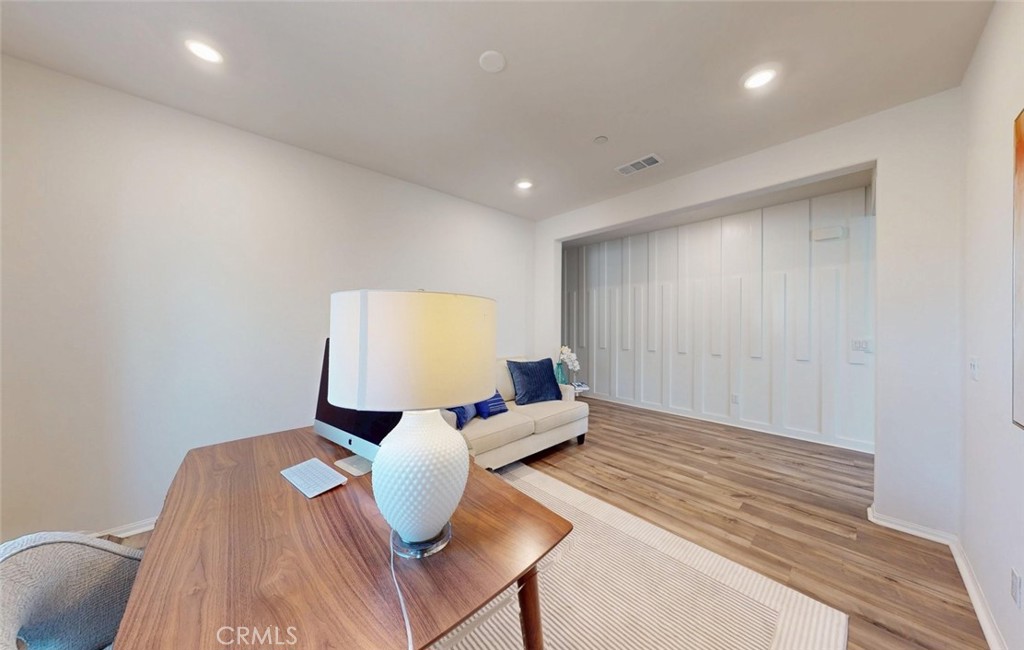 24320 Insignia Drive Menifee, CA 92584 - Photo 10 of 65 a living room with furniture and a wooden floor