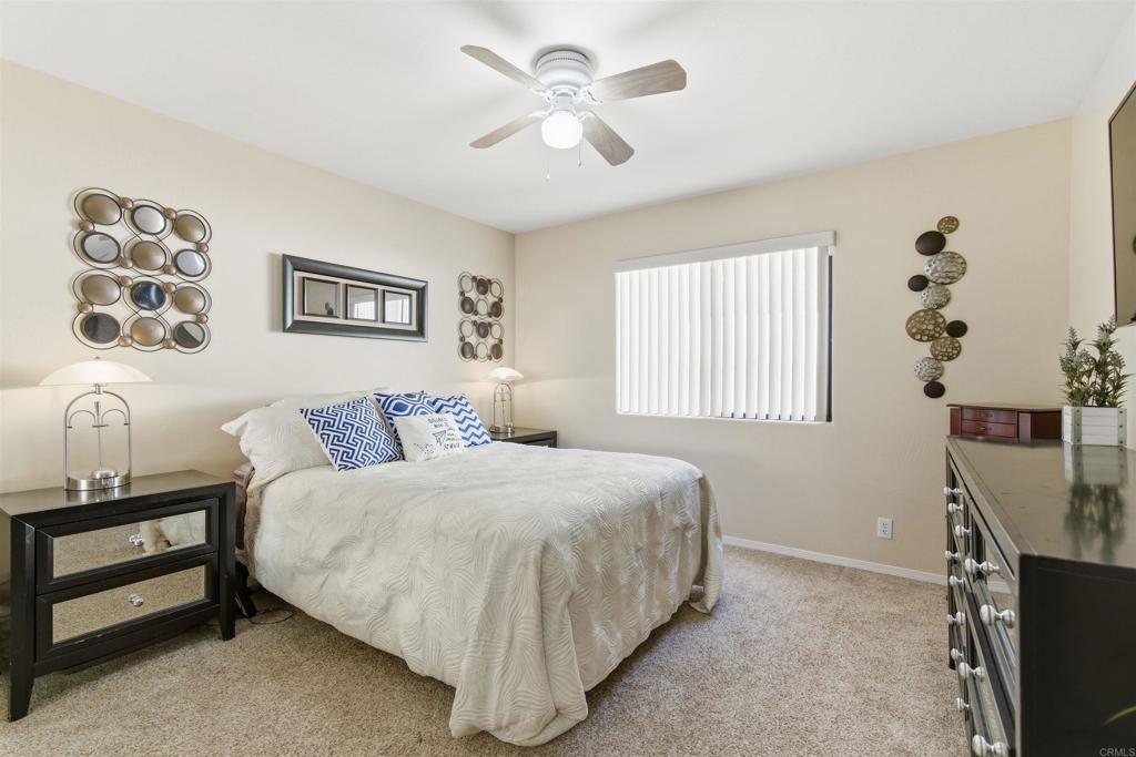 24586 Rutherford Road Ramona, CA 92065 - Photo 14 of 33 a bedroom with a bed and a window