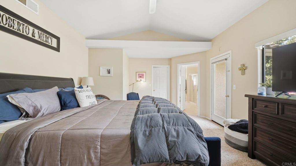 24586 Rutherford Road Ramona, CA 92065 - Photo 18 of 33 a bed sitting in a bedroom and view of living room