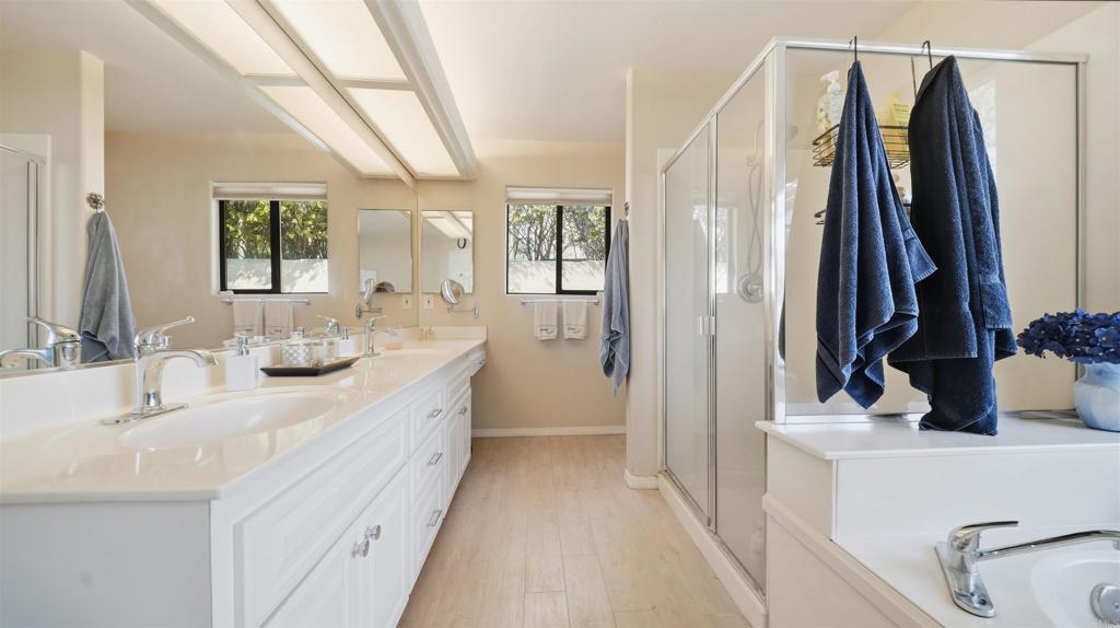 24586 Rutherford Road Ramona, CA 92065 - Photo 20 of 33 a bathroom with a double vanity sink and a mirror