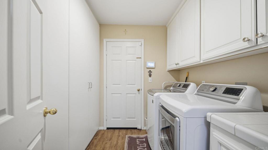 24586 Rutherford Road Ramona, CA 92065 - Photo 22 of 33 a utility room with dryer and washer