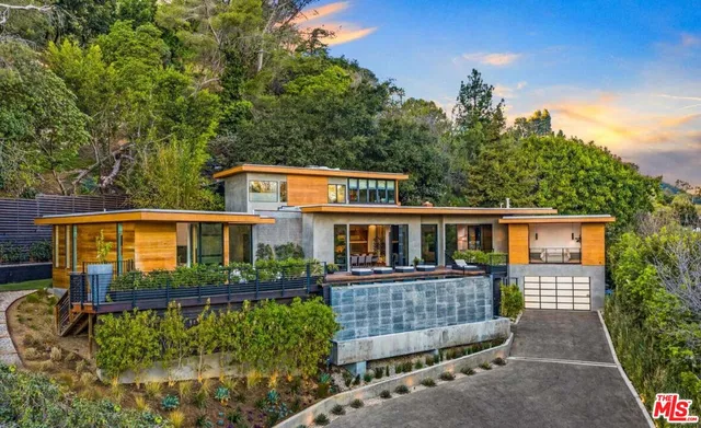 front view of a house with a garden