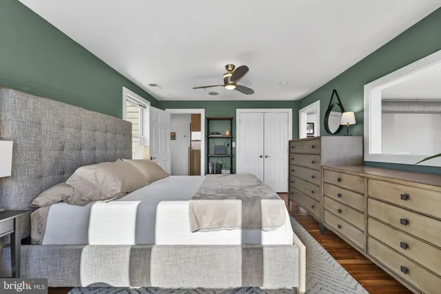 a bedroom with a bed and a dresser