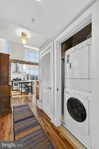 a view of a hallway with washer and dryer