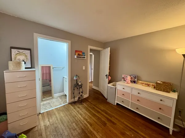 a room with furniture and wooden floor