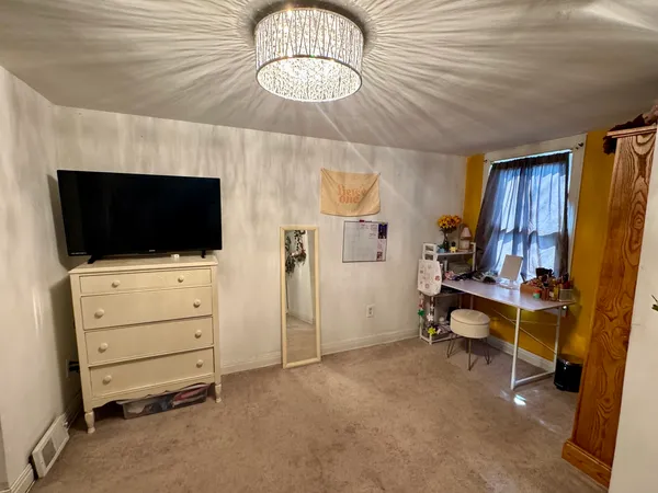 a room with furniture and flat screen tv