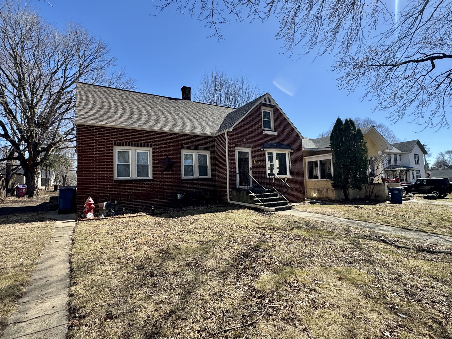 216 South Main Street Sheffield, IL 61361 - Photo 28 of 28 a front view of a house with a yard covered in snow
