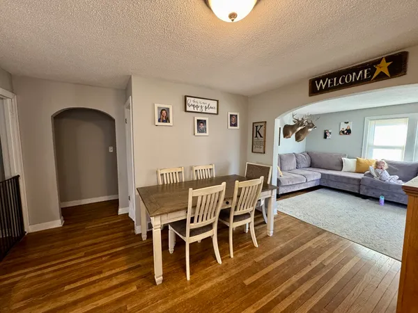 a view of a livingroom with furniture and wooden floor