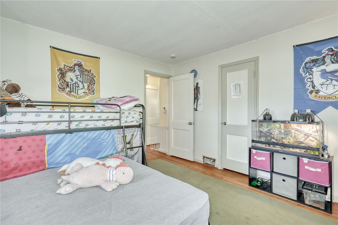 606 Bay Road Webster, NY 14580 - Photo 26 of 49 First floor bedroom with hardwood floors