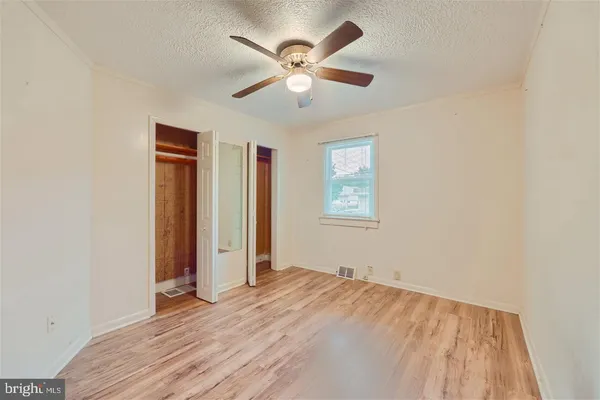 a bedroom with furniture and a book shelf