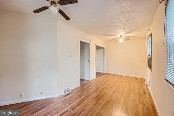 a view of a dining room with furniture and a window