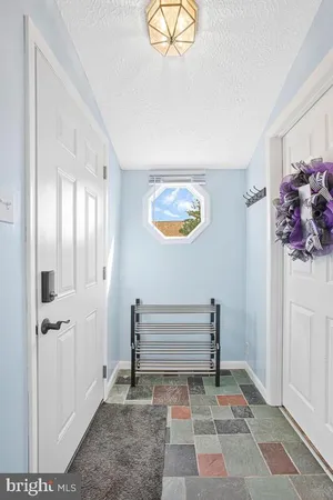 a view of a hallway with paintings on the wall