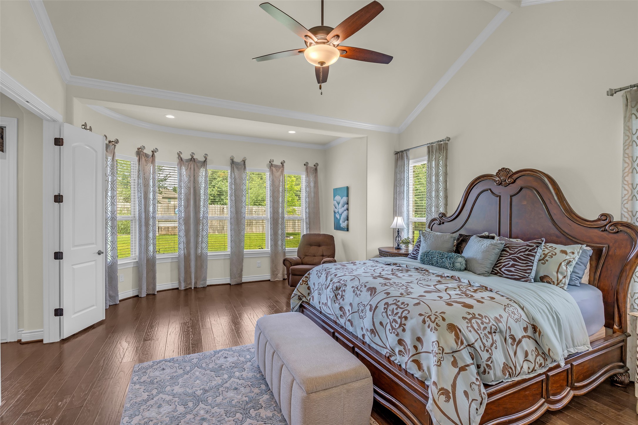 14003 South Evergreen Ridge Court Conroe, TX 77384 - Photo 21 of 43 Designed as a private retreat, the spacious primary suite offers a sitting area, and peaceful backyard views.