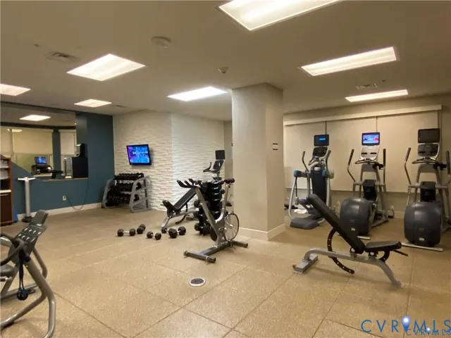 a lobby with furniture and a rug