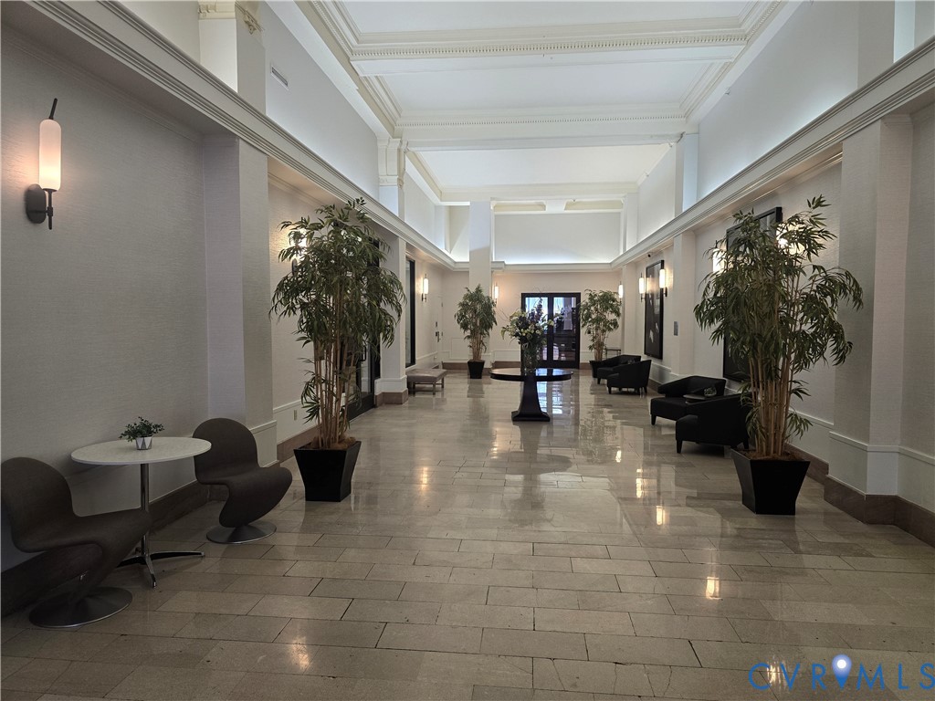 230 North 6th Street, Unit U318 Richmond, VA 23219 - Photo 2 of 24 a living room with fireplace furniture and a potted plant