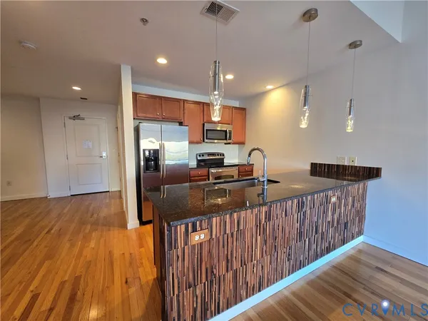 a view of kitchen with wooden floor