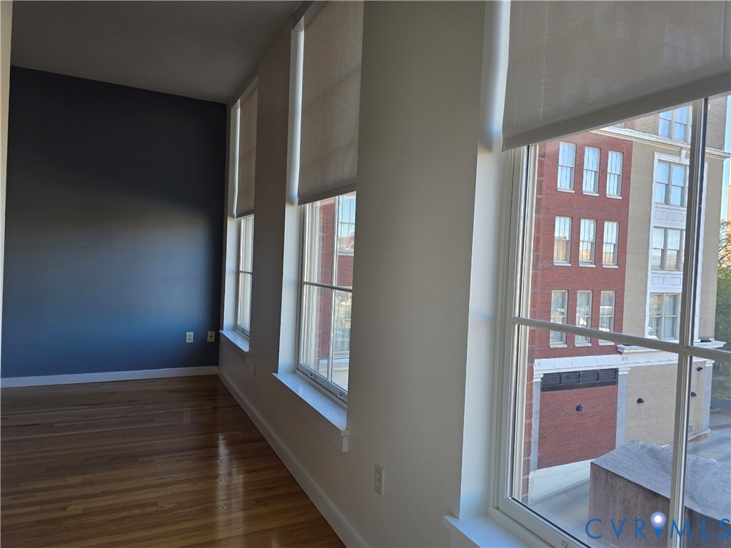 230 North 6th Street, Unit U318 Richmond, VA 23219 - Photo 9 of 24 a view of wooden floor and windows in a room