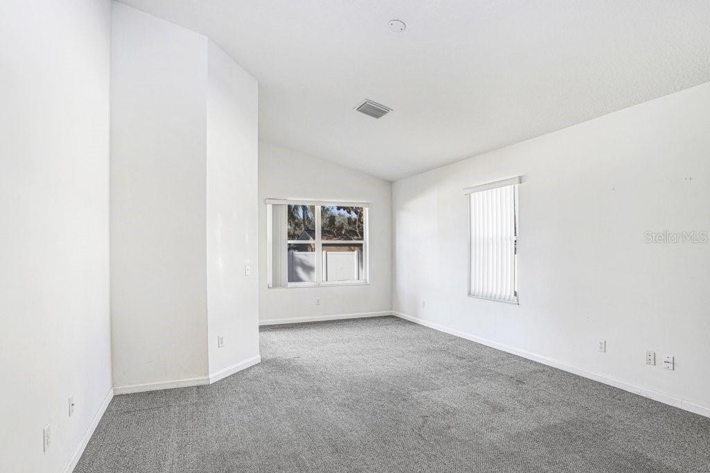 2412 Durant Road Valrico, FL 33594 - Photo 12 of 26 an empty room with windows