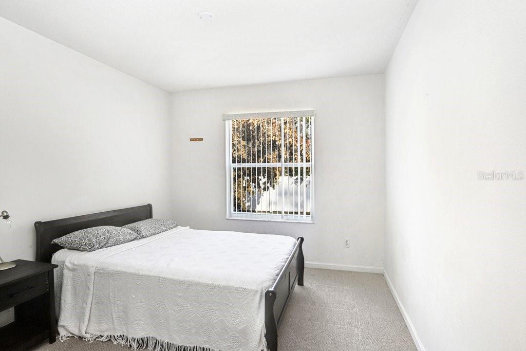2412 Durant Road Valrico, FL 33594 - Photo 17 of 26 a bedroom with a bed and a window