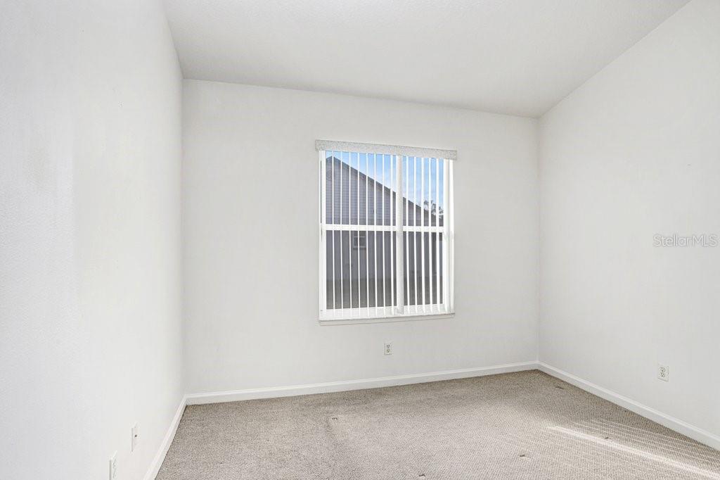 2412 Durant Road Valrico, FL 33594 - Photo 18 of 26 an empty room with windows