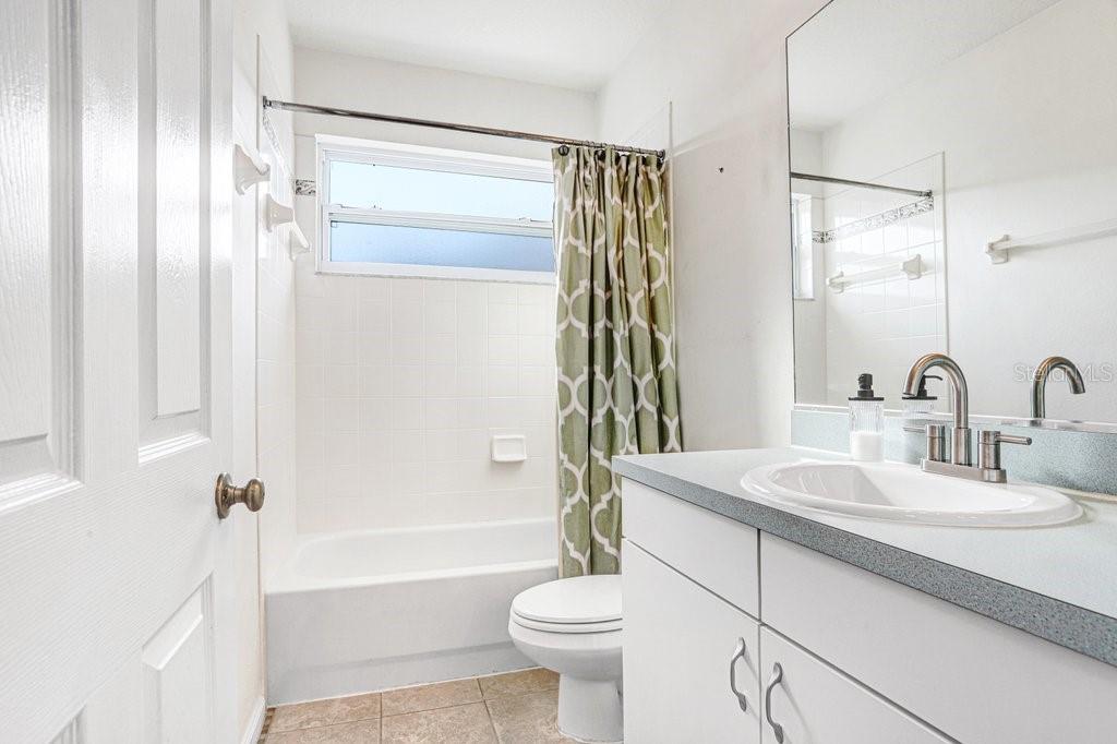 2412 Durant Road Valrico, FL 33594 - Photo 19 of 26 a bathroom with a sink toilet and shower