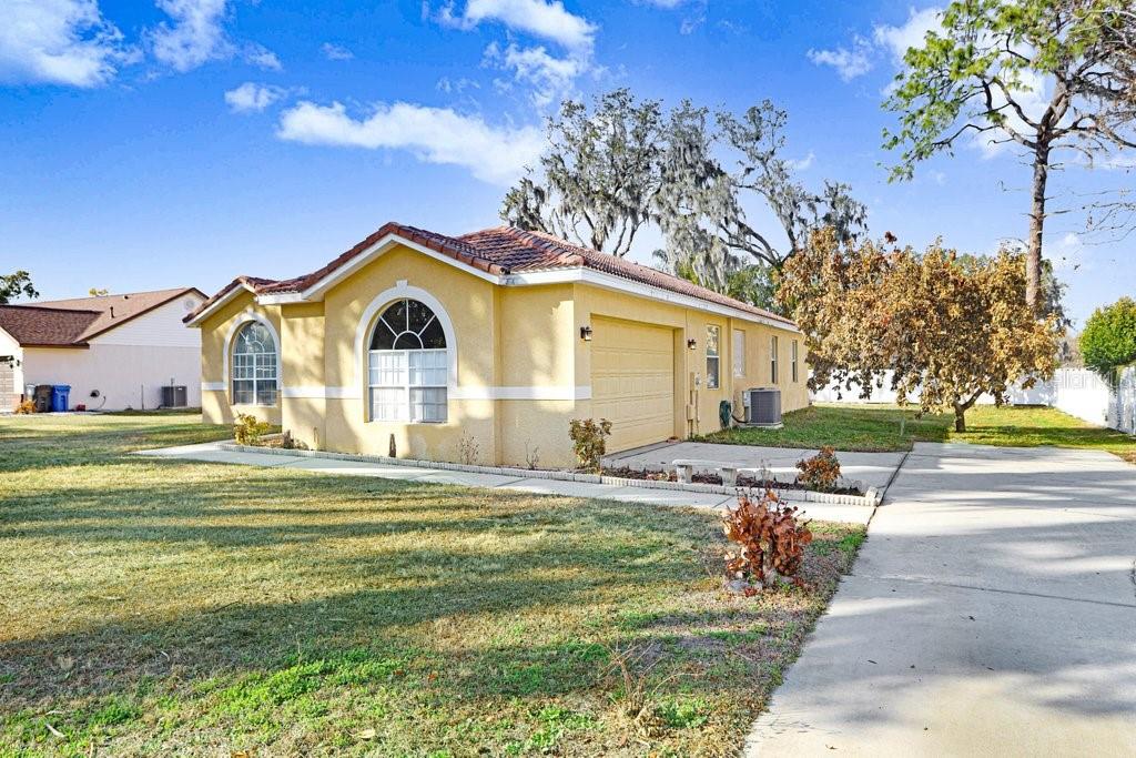 2412 Durant Road Valrico, FL 33594 - Photo 24 of 26 a front view of a house with garden
