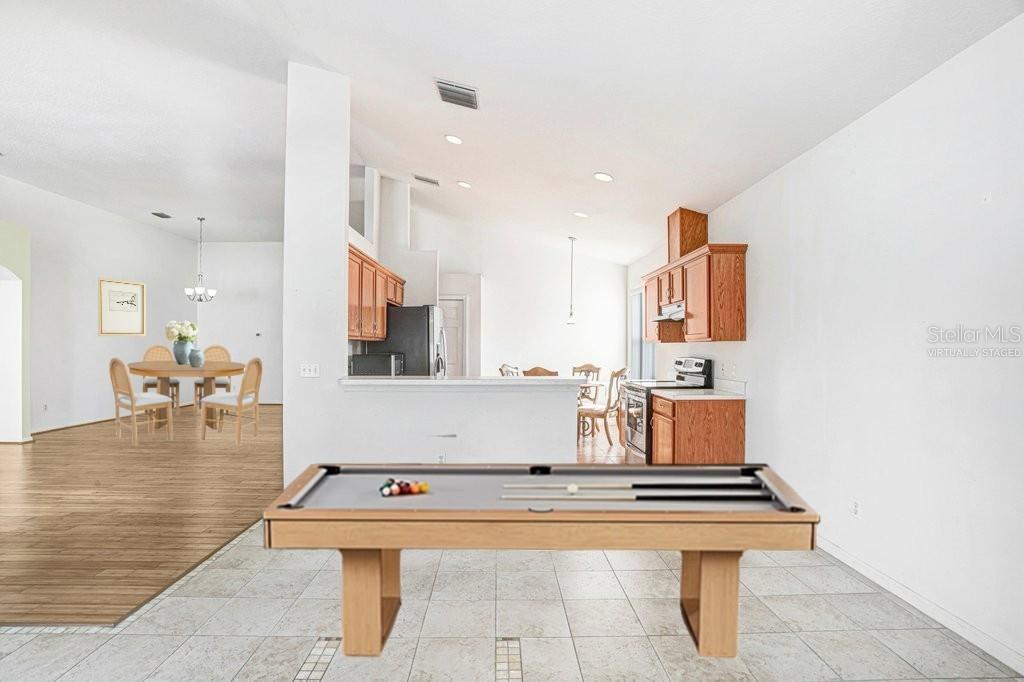 2412 Durant Road Valrico, FL 33594 - Photo 9 of 26 a living room with kitchen island furniture and a table