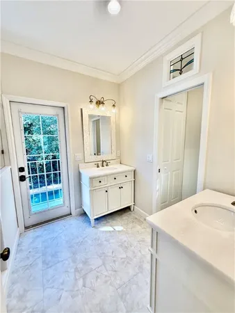 a spacious bedroom with a bed and a window