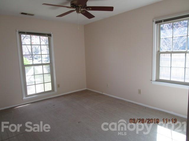 6800 Stoney Ridge Road Matthews, NC 28104 - Photo 12 of 15 an empty room with windows and fan