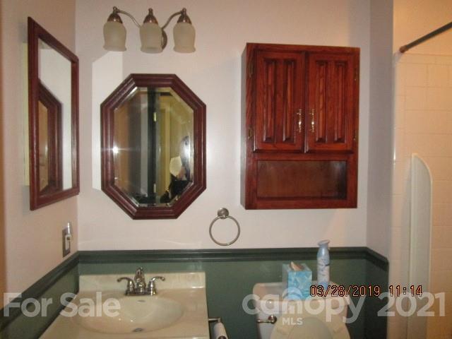 6800 Stoney Ridge Road Matthews, NC 28104 - Photo 14 of 15 a bathroom with a sink and a mirror