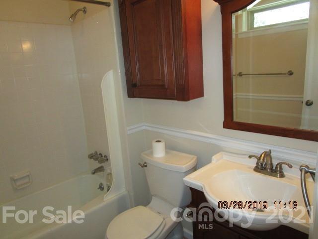 6800 Stoney Ridge Road Matthews, NC 28104 - Photo 15 of 15 a bathroom with a toilet a sink and bathtub